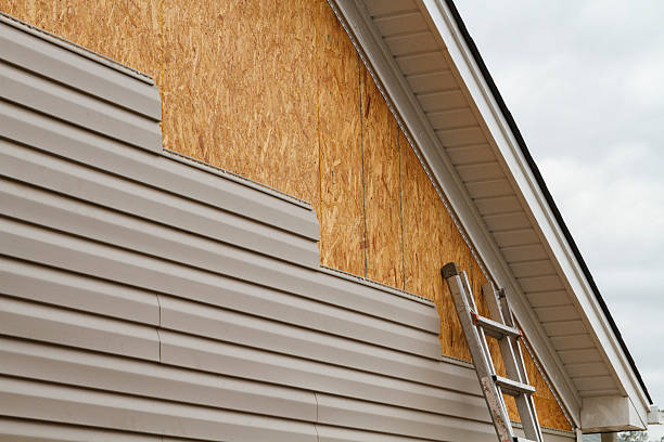 Professional Vinyl Siding technician working in Brave, PA